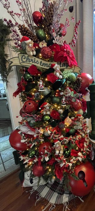 A red and green tree with oversized bells